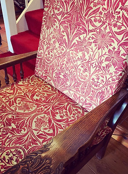 Renovated armchair with reupholstery and renergised ornate detail
