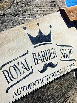 saw with business logo - Royal Barber Shop - stencil painted