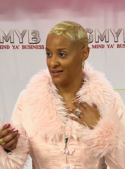 tonya picture in front of pink GMYB backdrop.jpg
