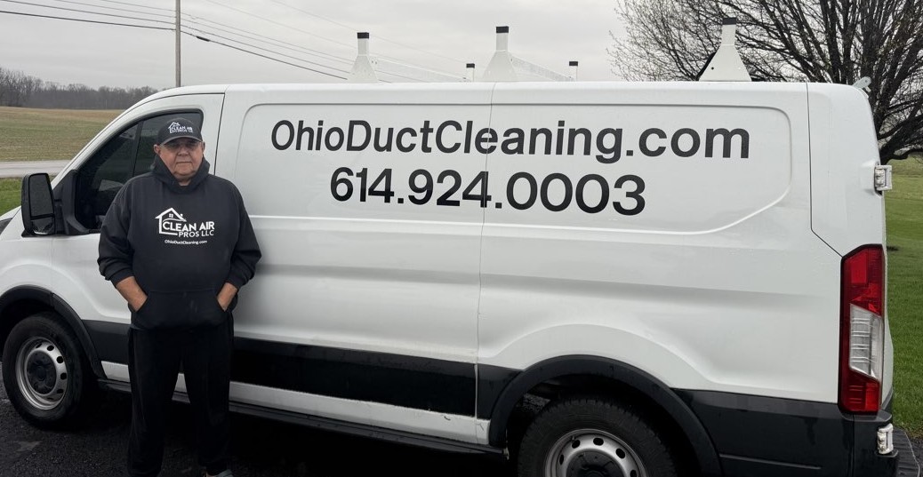 George Stelea — co-founder of Clean Air Pros LLC standing beside the branded service van in Columbus, Ohio