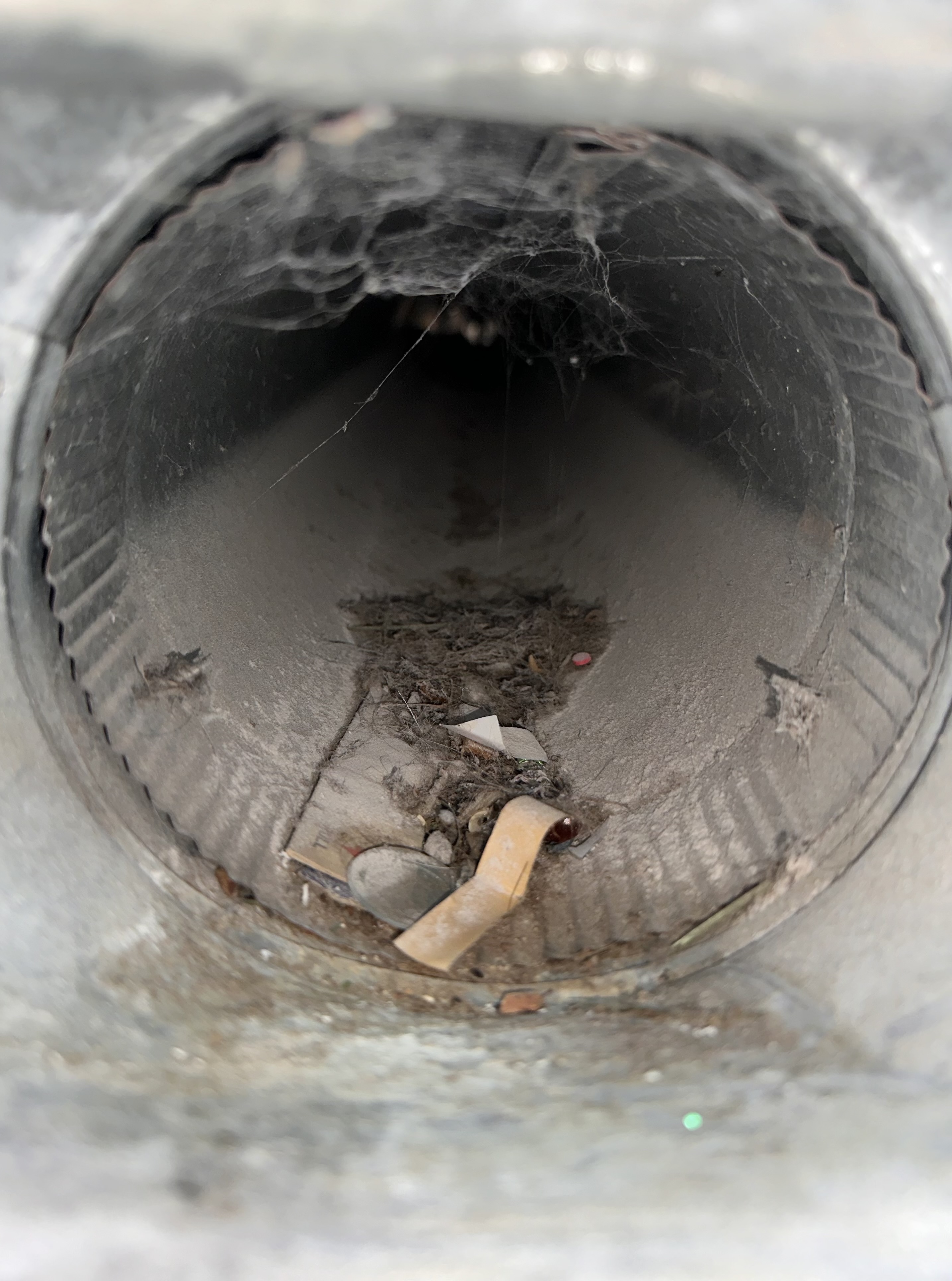 What a competitor left behind after a 'blow and go' air duct cleaning in Upper Arlington Ohio — debris still inside the vents