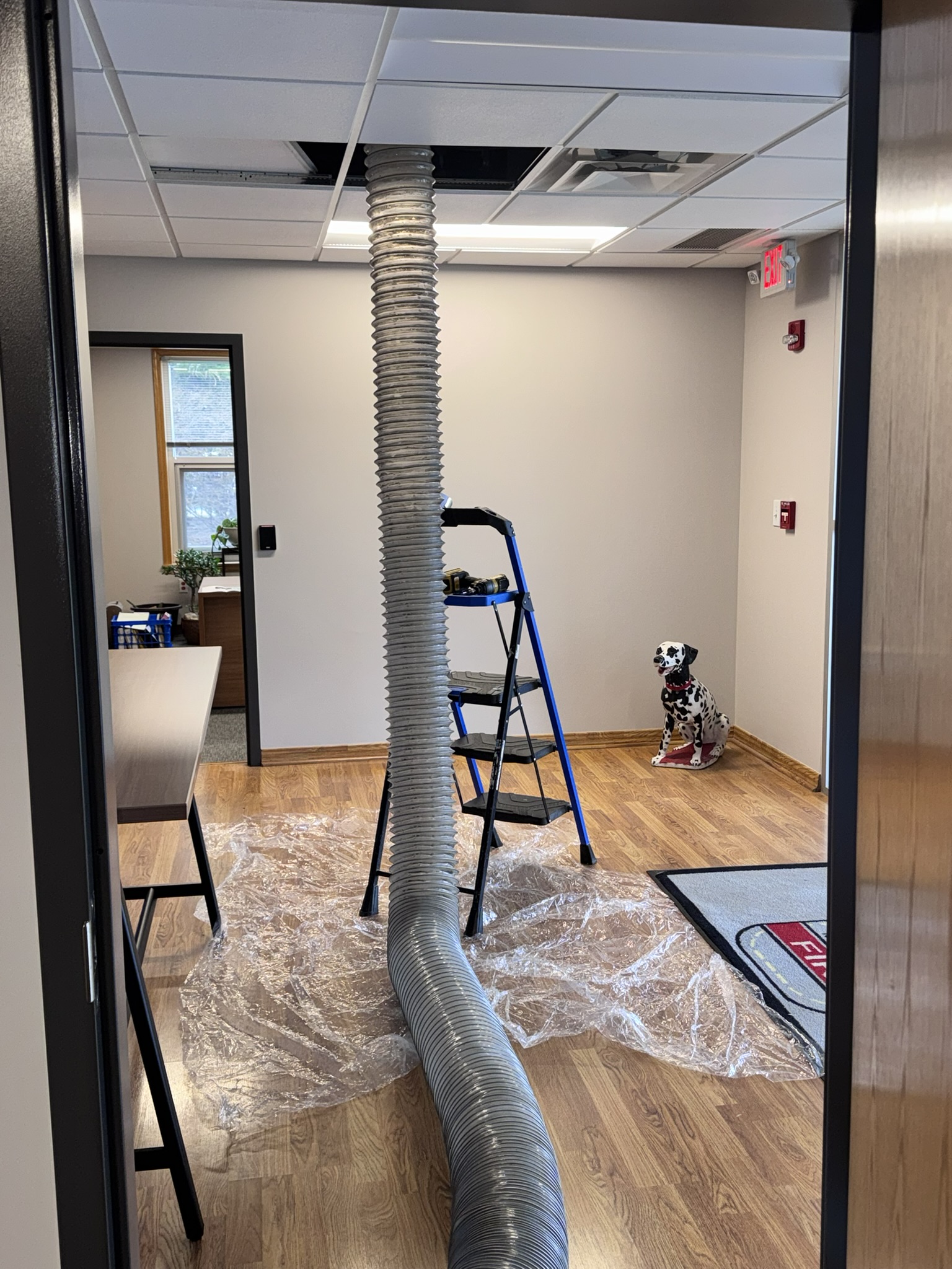 Clean Air Pros van inside Liberty Township Powell Ohio fire station bay alongside fire truck — commercial duct cleaning service