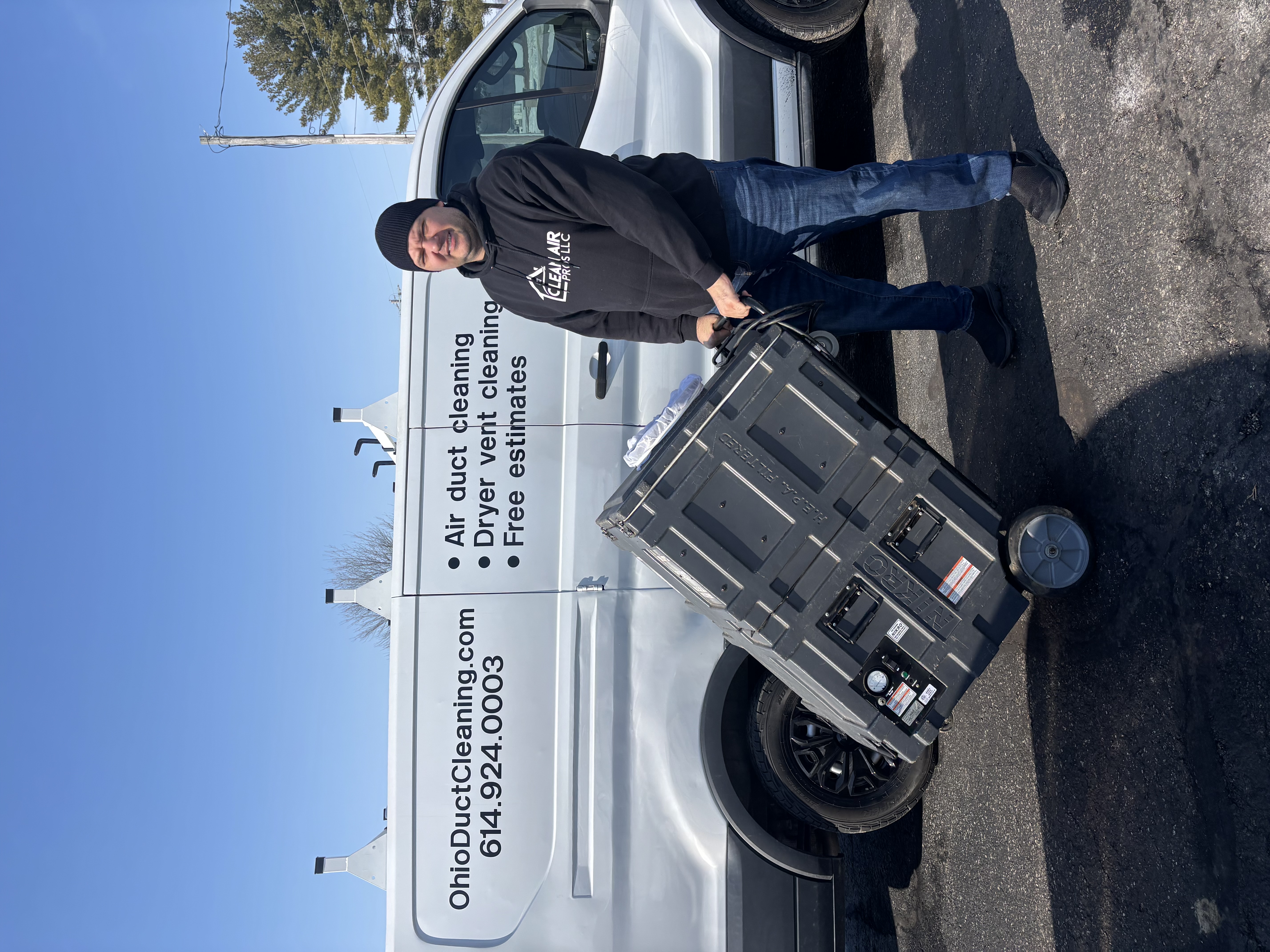 Clean Air Pros technician with Bertha HEPA negative pressure duct cleaning system and branded van, Columbus Ohio