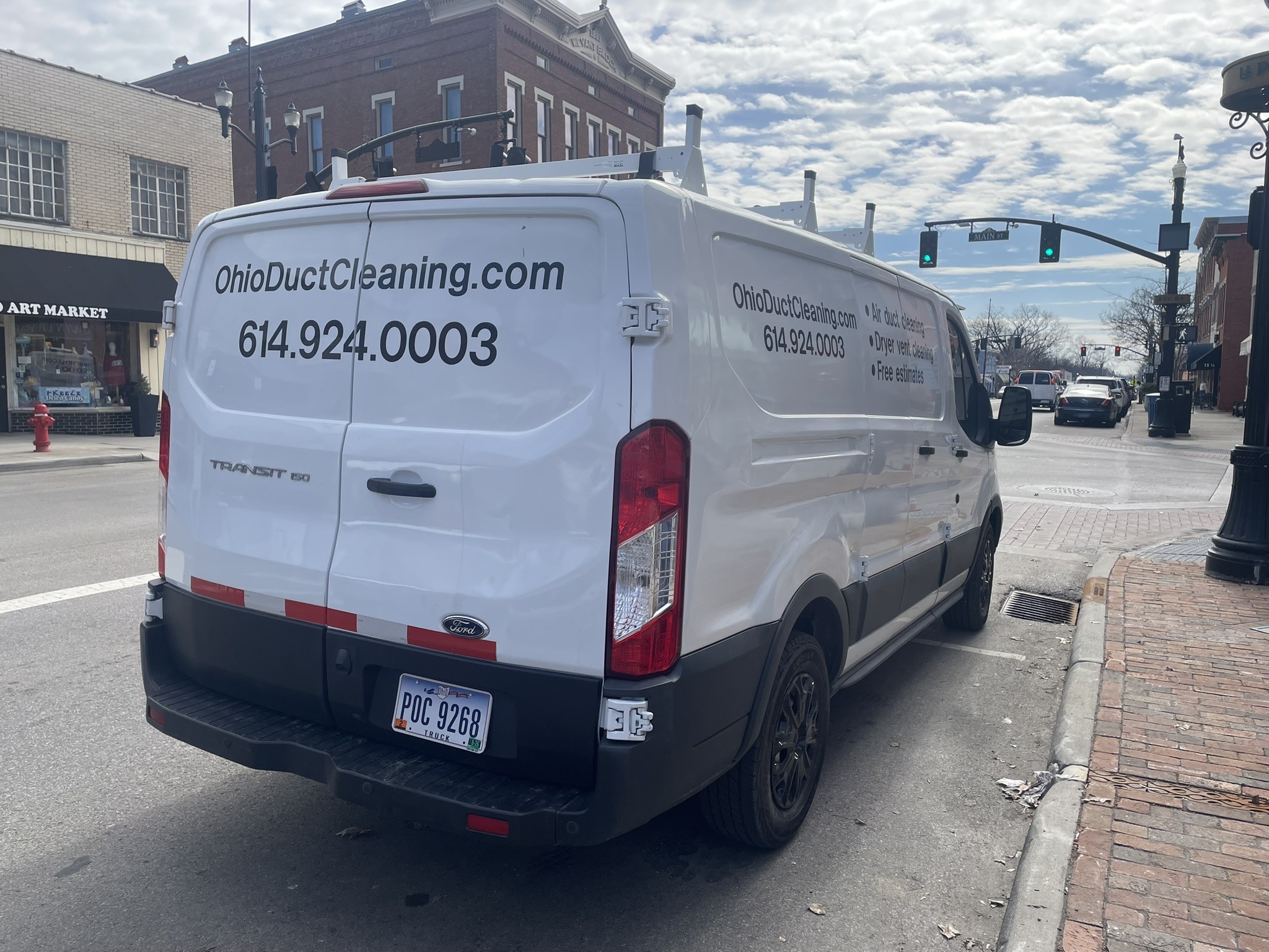 Clean Air Pros van on Westerville downtown commercial strip — small business duct cleaning
