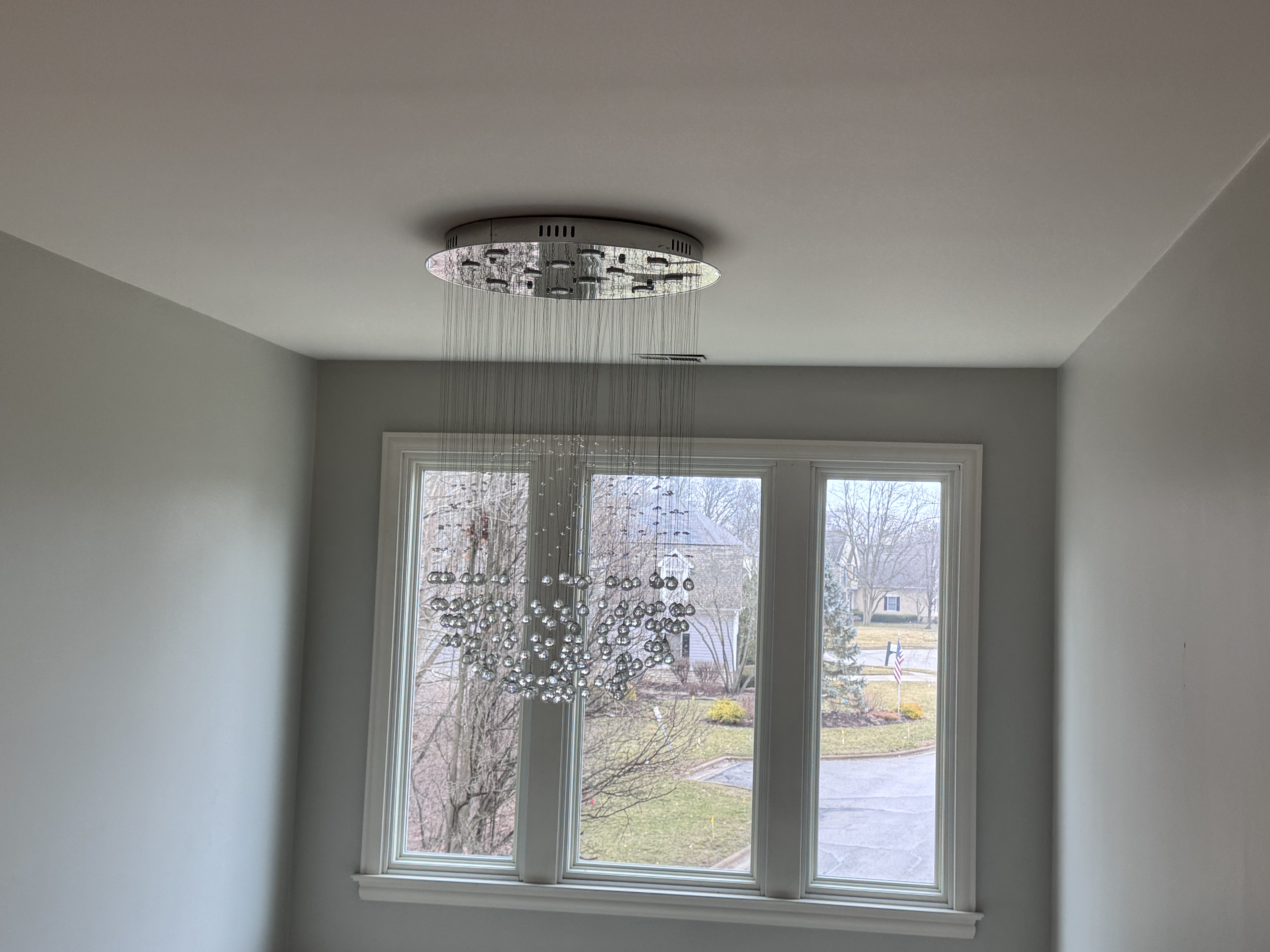 Beautifully remodeled Powell Ohio home dining room — crystal chandelier, fresh paint, new finishes