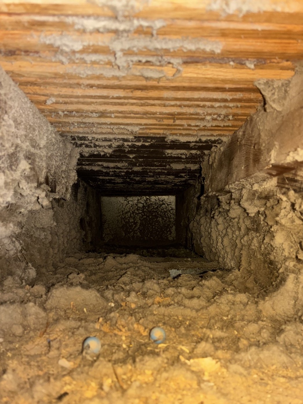 Dirty air duct before cleaning — years of dust and debris buildup Columbus Ohio home