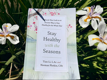 Stay Healthy with the Seasons book with flowers in the background