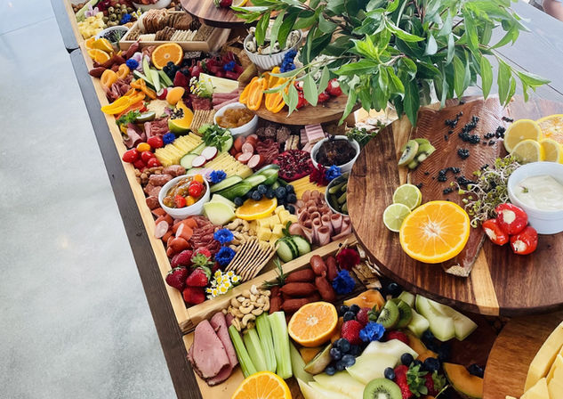Wedding Grazing Table used for cocktail hour, styled by Fern & Feta Catering.