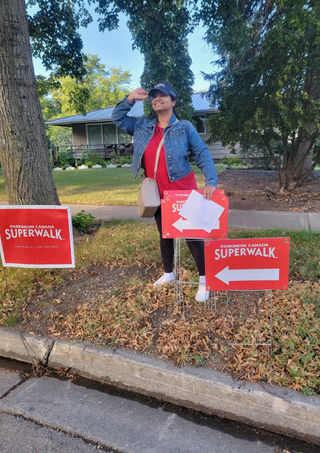 volunteer setting up signs