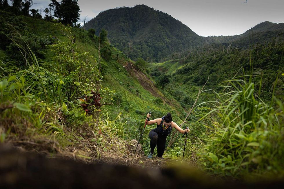 Dominica adventure challenge participant with hiking poles