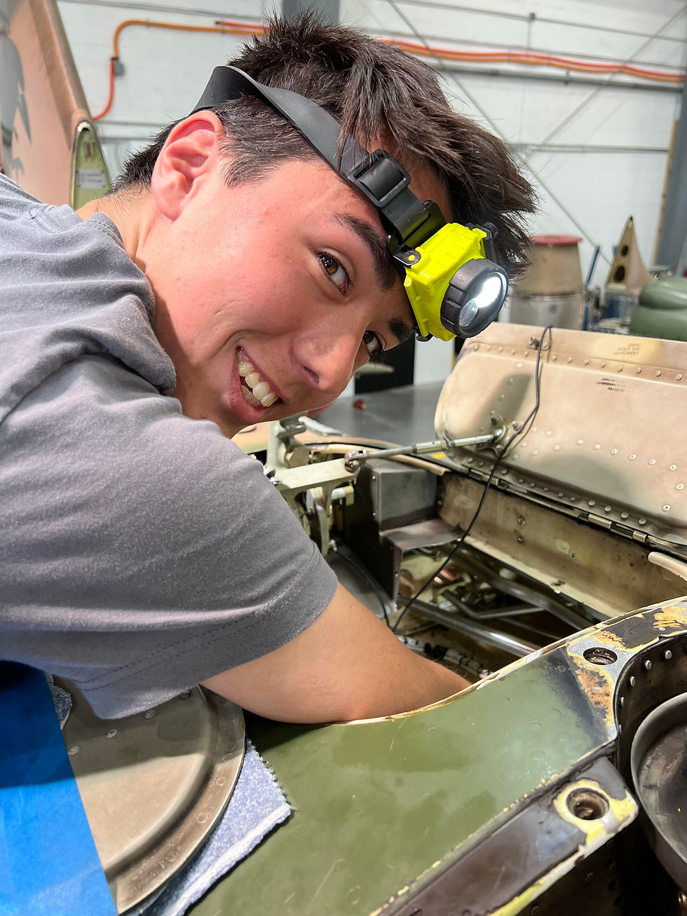 Man fixing a military jet