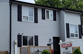 This beautiful exterior house painted gray and black by our professional painter at ultimate painters.