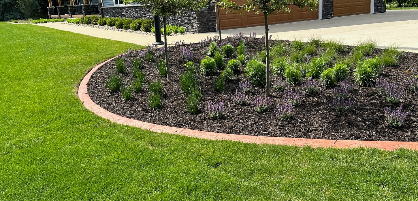 custom curbing bordering a garden bed