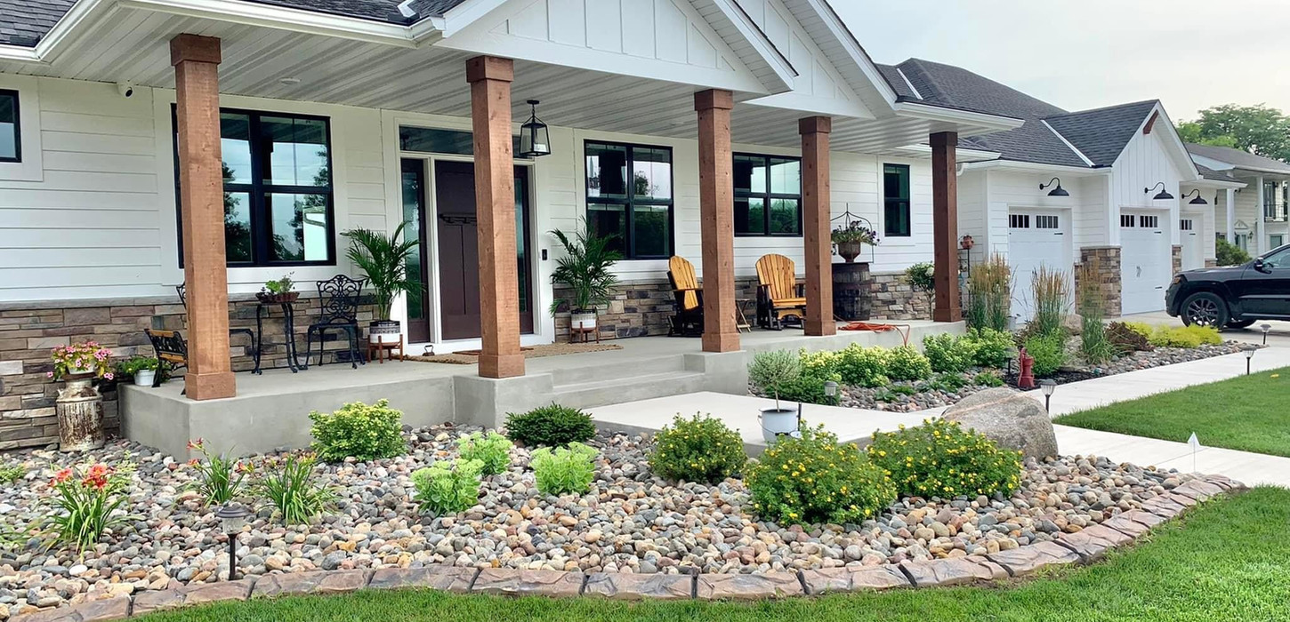 decorative curbing in front of house bordering a garden bed