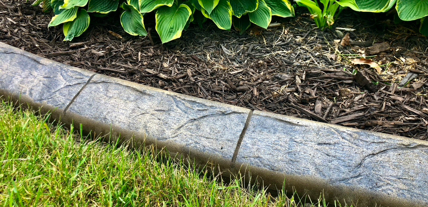 curbing in yard next to hostas