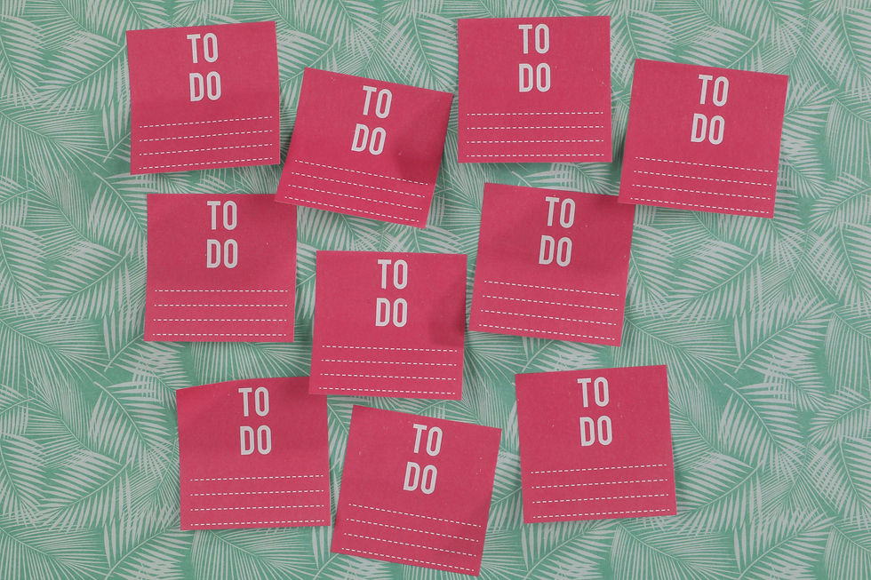 Red "TO DO" sticky notes on green leaf-patterned background. Notes have dotted lines for writing tasks. Bright and organized layout.