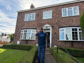 Surveyor Outside a Property
