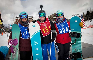 Alica Thompson standing with snowboard