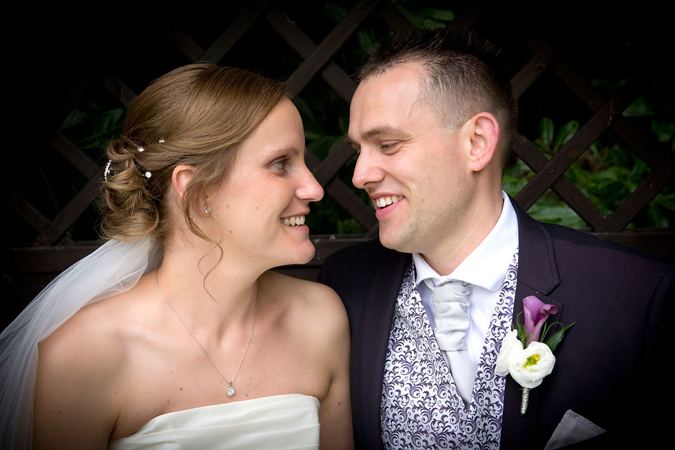 Bride & Groom looking at each other and smiling
