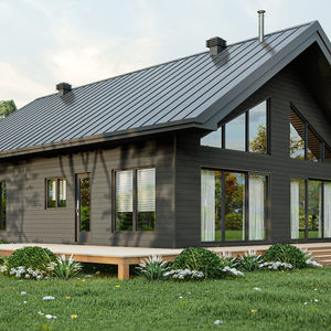 Façade d’un chalet contemporain avec architecture moderne et toiture métallique.