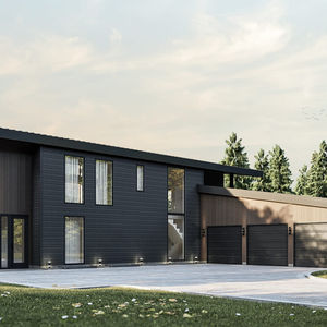 Façade avant d’une résidence moderne avec immense garage triple