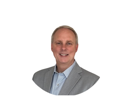 Headshot of Brad Nicholls smiling
