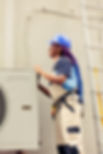 african-american-engineer-dissasembling-outdoor-air-conditioner-metal-top-coil-panel-check