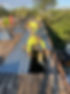 Roofing Workers Installing Panels.jpg