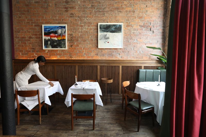 A beautifully plated gourmet appetizer served in an elegant bistro setting with soft lighting.