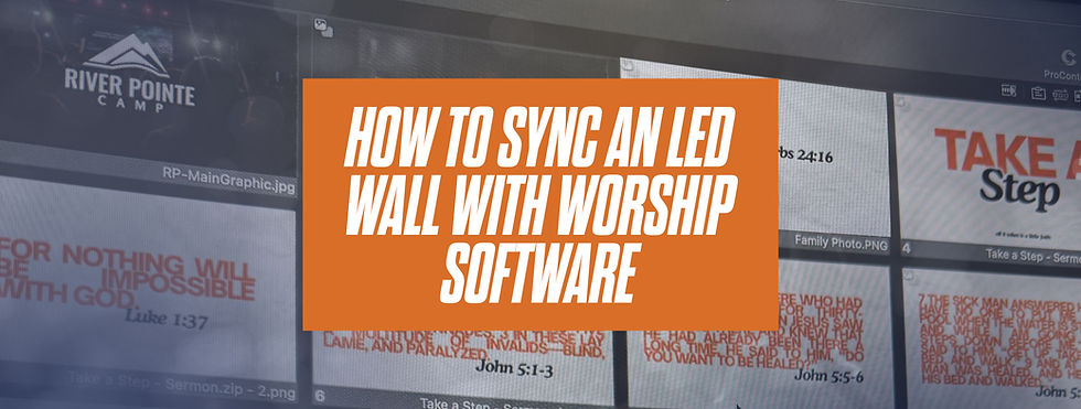 Church tech booth sending lyrics and a camera feed to an LED video wall behind the platform.
