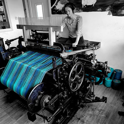 Martha weaving at the loom