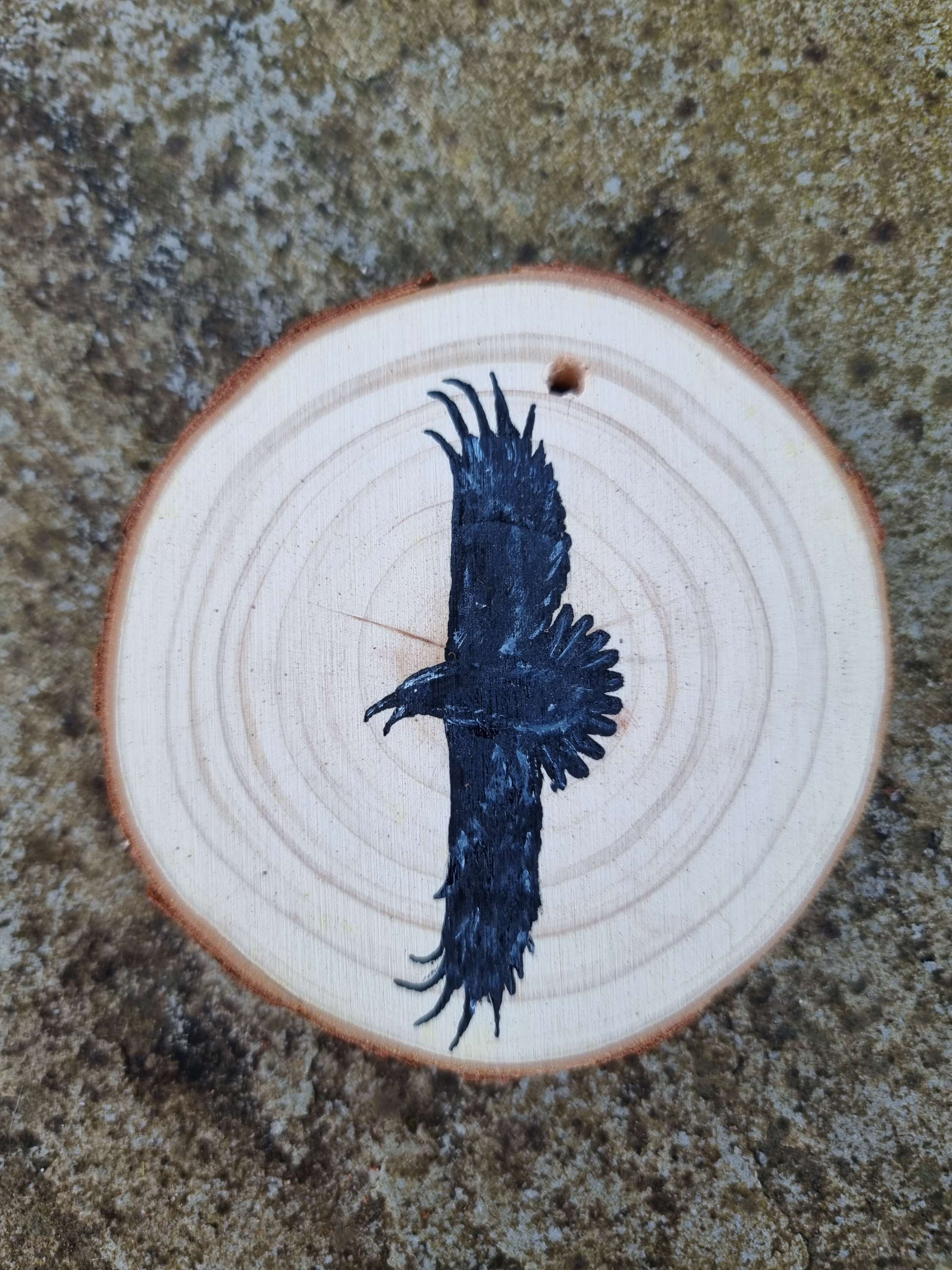  Raven on wood slice