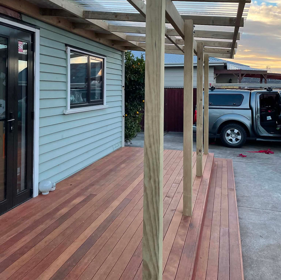 Kwila timber deck with covered pergola creating a sheltered outdoor living area in Christchurch