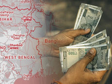 Finance Minister Swapan Dasgupta presenting West Bengal Budget 2026 in the state assembly.