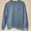 Thumbnail: Light Blue Second Hand Sweatshirt with embroidery of a blue goldfish bowl with an orange goldfish on the top left of the sweatshirt