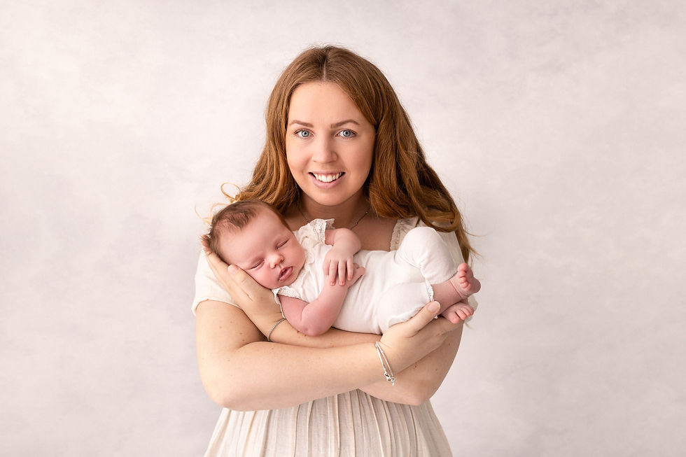 A mum cuddling a new born baby