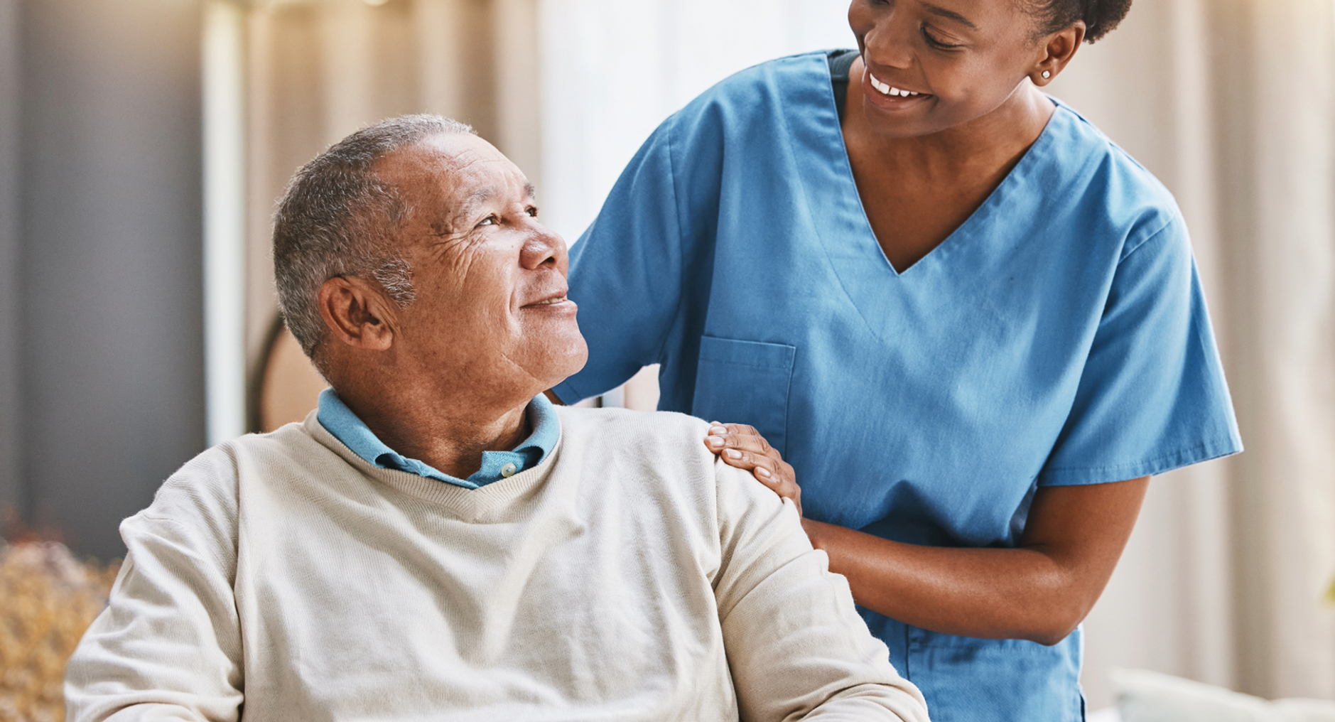 home care aide helping older man