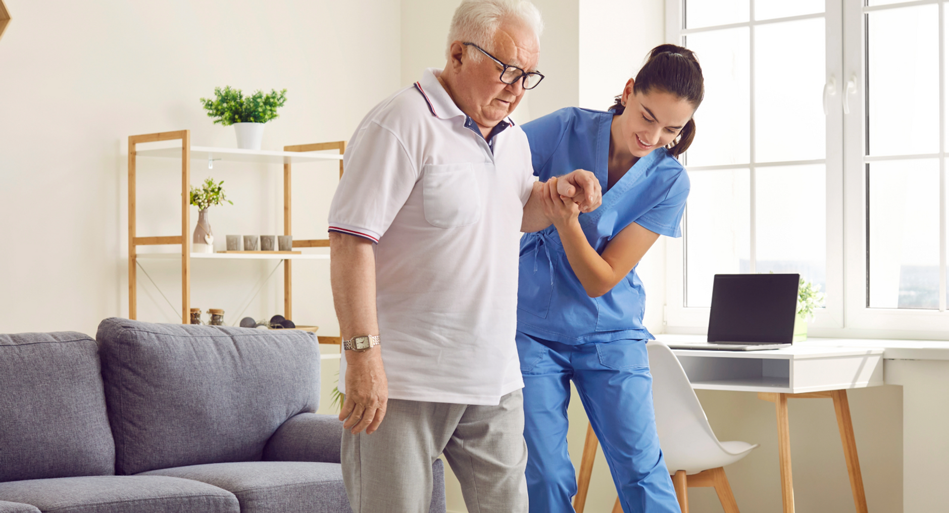 home care aide helping older man