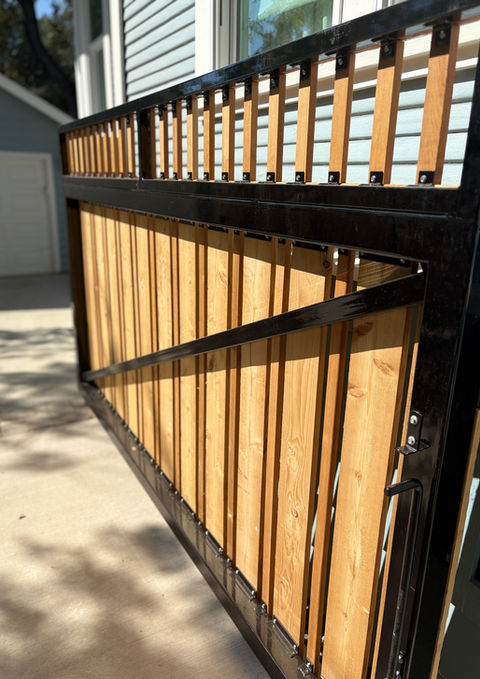 Custom 18-foot double driveway gate for backyard security and cohesive fencing in Alamo Heights home.