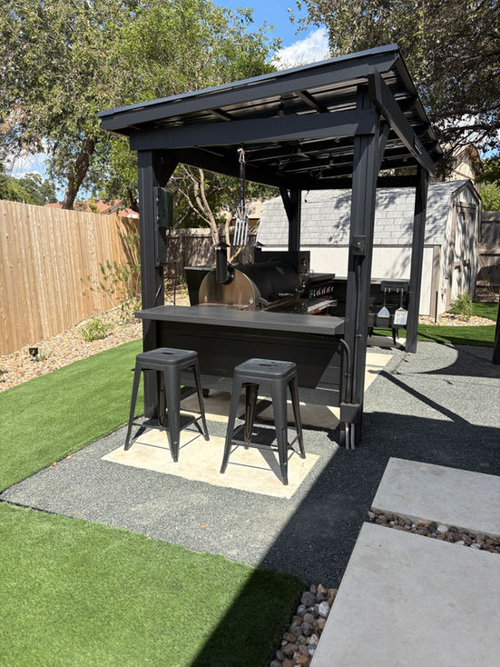 Pergola grilling station with space for Traeger and Blackstone grill in San Antonio outdoor living space.