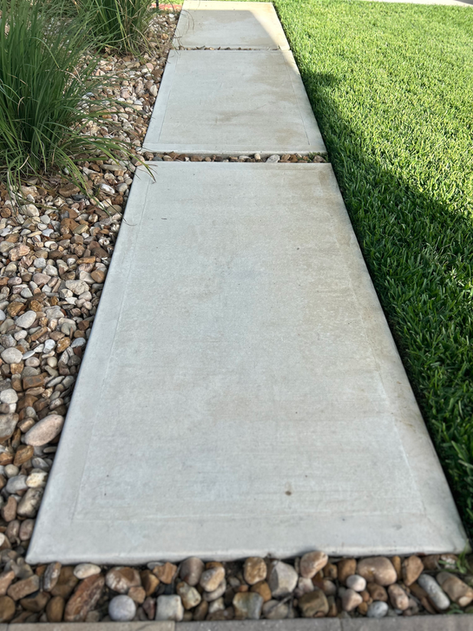 Completed outdoor living space with Belgard pavers, outdoor kitchen, and fire pit — Castle Hills, San Antonio TX
