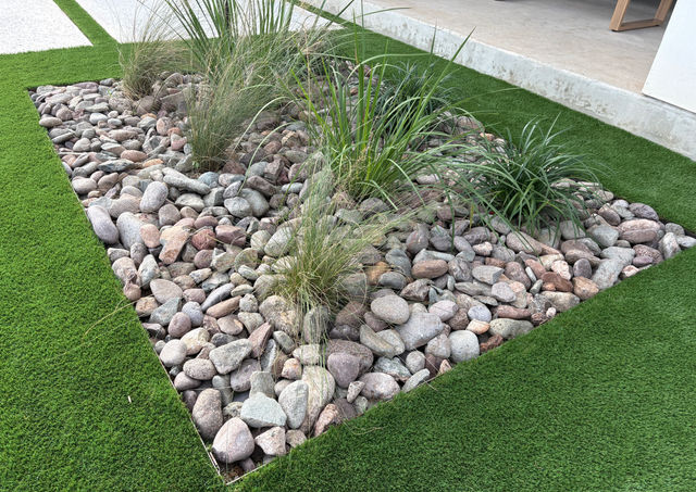 Expansive Hill Country backyard renovation featuring pavilion, pool, xeriscape beds, and modern architecture.