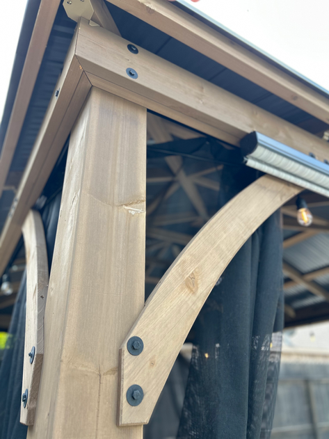 Pergola detail with Corten steel planters and Colorado Riverstone landscape — Champion Heights, Boerne TX
