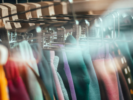 A rack of colorful clothing.