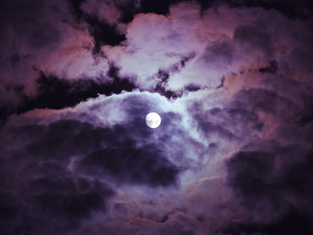 A full moon in night sky.
