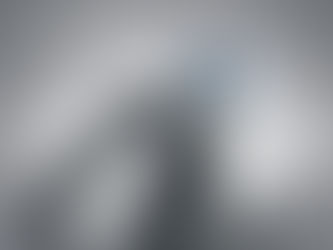 Dermalogica cream atop silver blocks labeled collagen and elastin on gray background. Text: "Invest in skin's future."