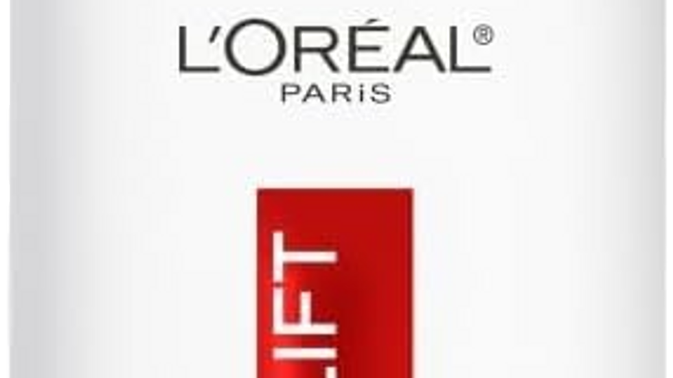 White serum bottle with an orange cap, labeled "L'Oréal Paris Revitalift Clinical." Text features "Pure 12% Vitamin C Serum, 30ML."
