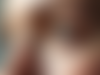 Close-up of a person's green eyes looking intently forward. Detailed eyelashes and eyebrows. Soft lighting creates a calm atmosphere.