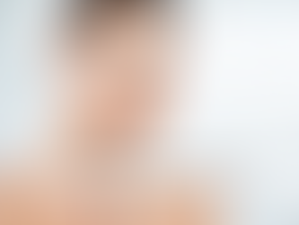 Woman gently touches her face, smiling in soft light, with the text "SKIN REGENERATION" overlayed. Background is blurred and serene.