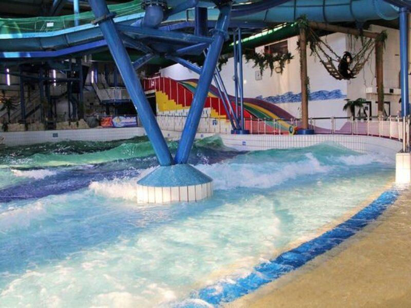 picture of swimming pool with water slides in